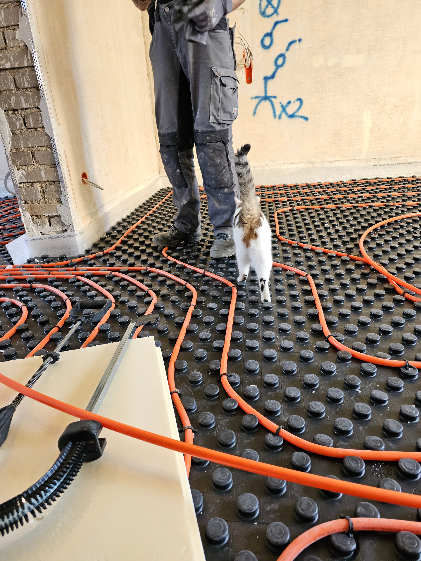 Underfloor heating loops being laid