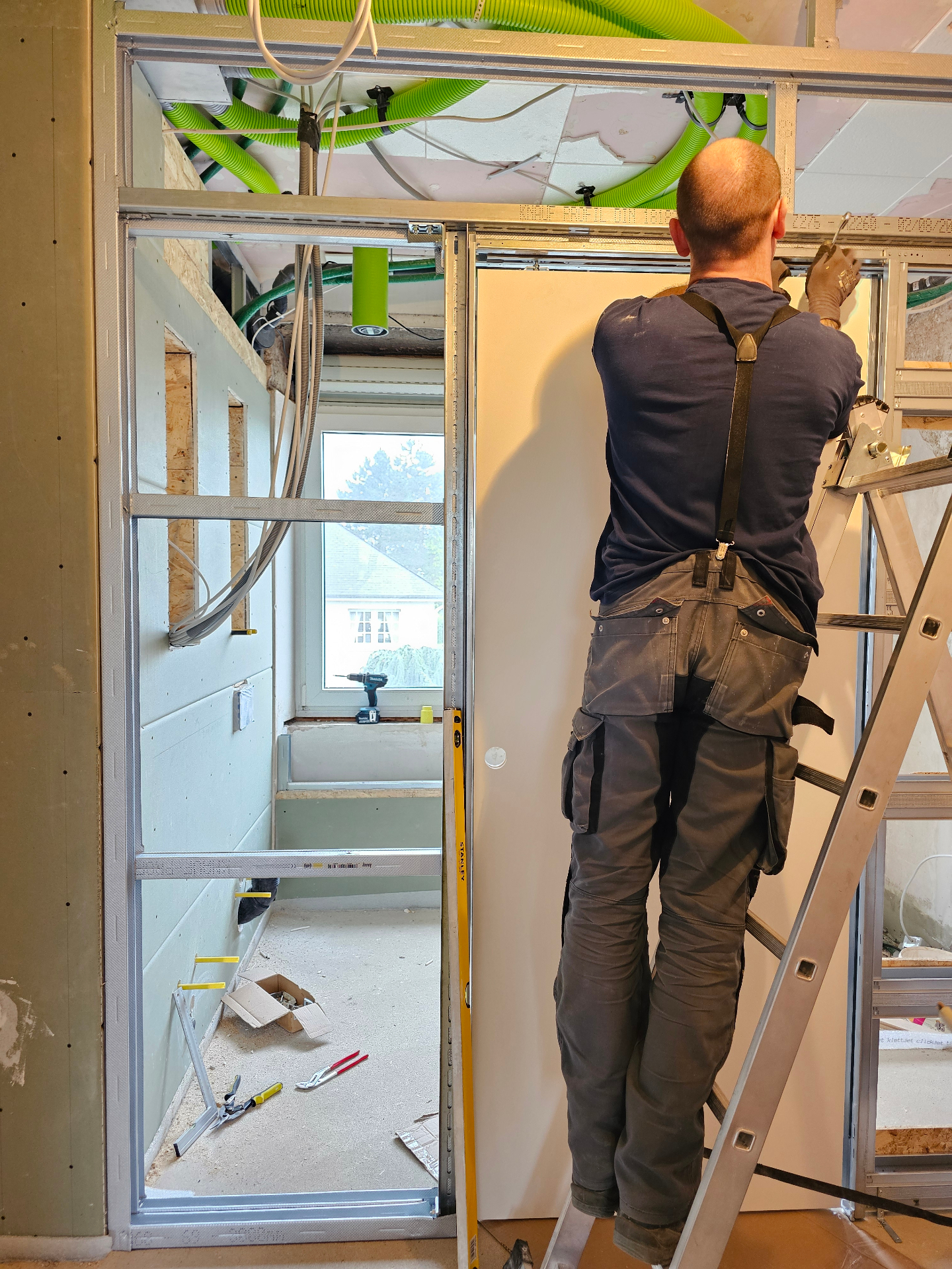 Drywall & hidden door installation on site
