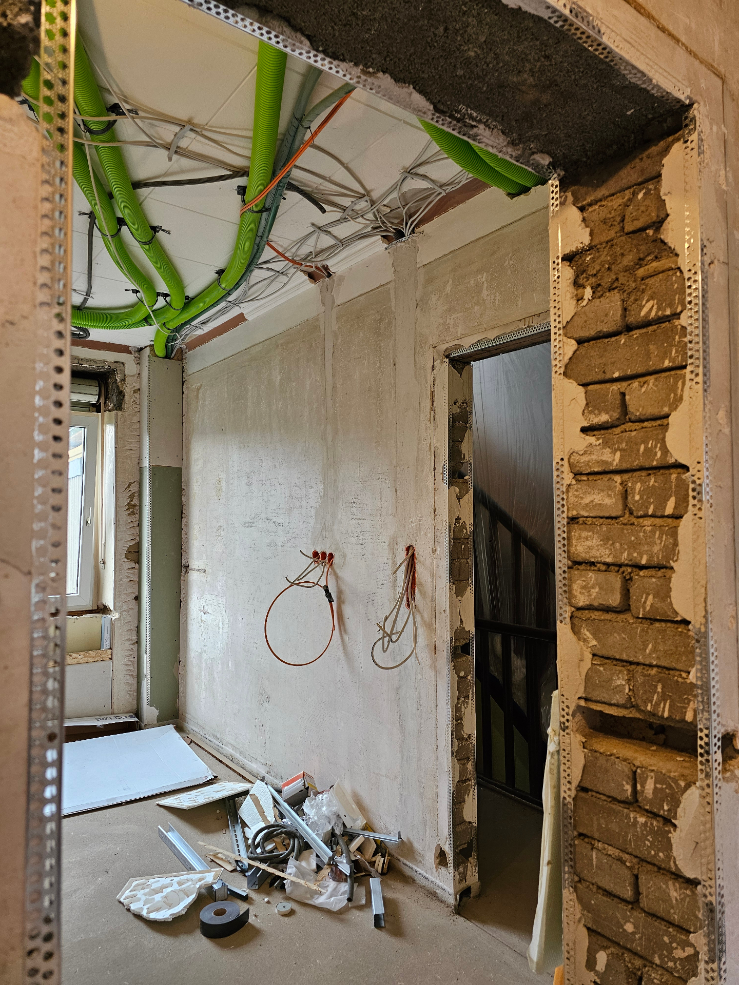 Ventilation pipes and electrical routing above a new opening