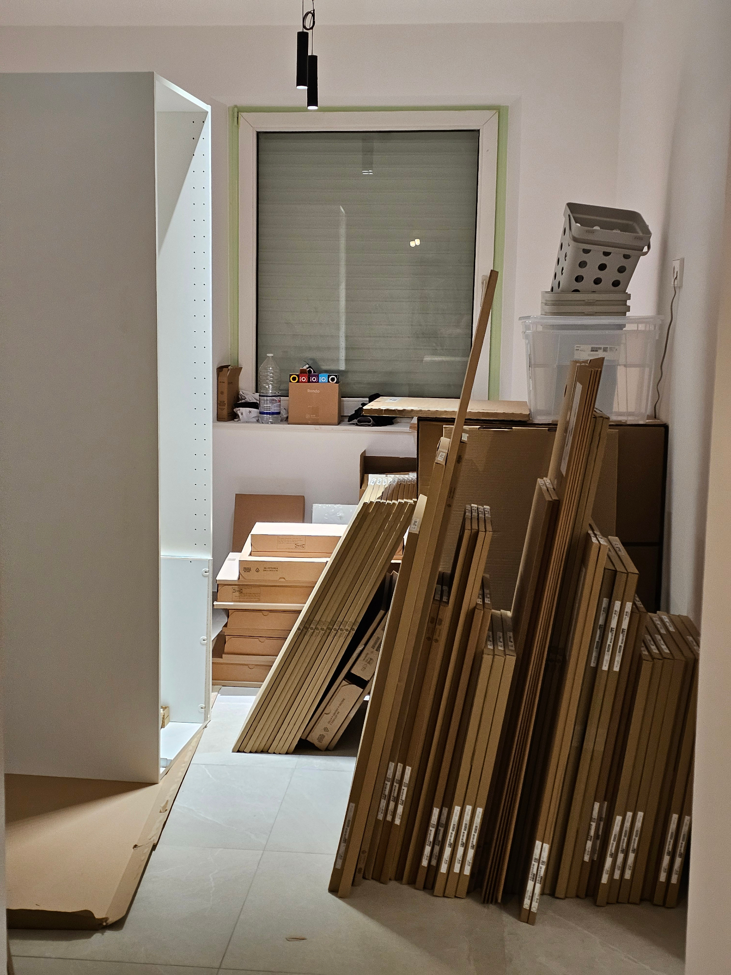 Flat-pack furniture staged for assembly after renovation